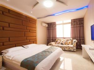 เตียงในห้องที่ Shell Huaibei City Xiangshan District Cuifeng Road Hotel