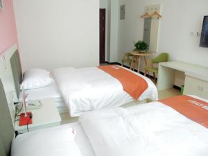 Postel nebo postele na pokoji v ubytování Shell Langfang Bazhou Museum Yingbin Dongdao Hotel