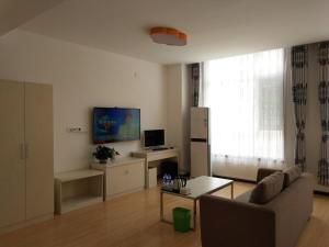 TV a/nebo společenská místnost v ubytování Shell Langfang Bazhou Museum Yingbin Dongdao Hotel