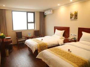 Katil atau katil-katil dalam bilik di GreenTree Inn HeNan ShangQiu Normal College WenhuaWestRoad Business Hotel