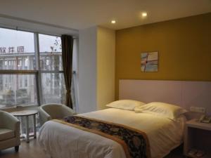 Katil atau katil-katil dalam bilik di Shell Jinan Gaoxin District Shunhua Road Qilu Software Park Hotel