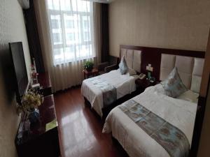 Fotografie z fotogalerie ubytování GreenTree Inn GanSu JiuQuan GuaZhou ZhangZhi Park Express Hotel v destinaci Anxi