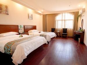 Een bed of bedden in een kamer bij Greentree Inn Mozitan Road Yiwu Small Commodities Wholesale City