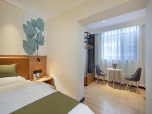 Säng eller sängar i ett rum på GreenTree Inn Kunming Nanping Pedestrian Street Hotel