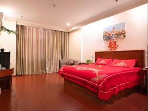 Een bed of bedden in een kamer bij Greentree Inn Mozitan Road Yiwu Small Commodities Wholesale City