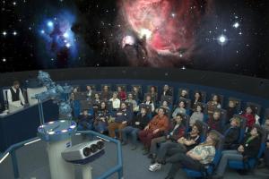a group of people sitting in a movie theatre at Ferienwohnung Jurk in Bärenstein