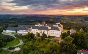 an aerial view of a large building on a hill at Ferienwohnung Jurk in Bärenstein