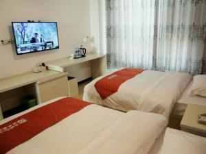 Postel nebo postele na pokoji v ubytování Shell Langfang Bazhou Museum Yingbin Dongdao Hotel