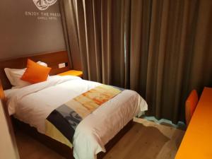 Postelja oz. postelje v sobi nastanitve Shell Liaocheng Linqing City Bus Station Hotel