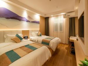 Letto o letti in una camera di VX Xuzhou Yunlong District Normal University Yunlong Mountain Scenic Spot Hotel