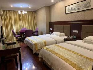 Katil atau katil-katil dalam bilik di GreenTree Alliance Suzhou Taicang South Changchun Road Liuyuan Hotel