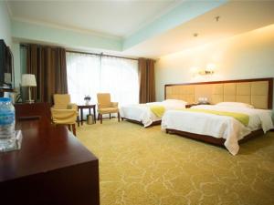 Rúm í herbergi á GreenTree Alliance Nanping Yanping District Xinjian Road Hotel