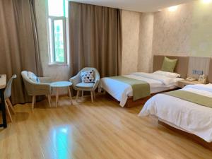 Postel nebo postele na pokoji v ubytování GreenTree Inn Cixi Suntang North Road Hotel