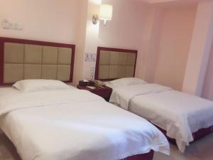 Rúm í herbergi á GreenTree Alliance Nanping Yanping District Xinjian Road Hotel