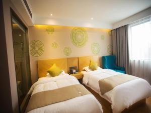 Katil atau katil-katil dalam bilik di GreenTree Inn Anqing Tongcheng Tong'an Road South Bus Station Business Hotel