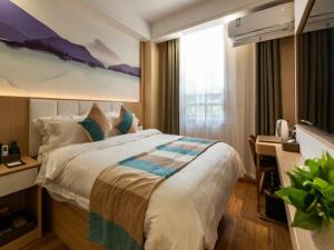 Letto o letti in una camera di VX Xuzhou Yunlong District Normal University Yunlong Mountain Scenic Spot Hotel