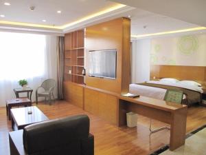 Voodi või voodid majutusasutuse GreenTree Inn Nei Monggol Autonomous Region Alxa Left banner Wealth Center Business Hotel toas