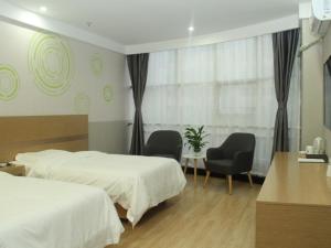 Ένα ή περισσότερα κρεβάτια σε δωμάτιο στο GreenTree Inn Lvliang Xiaoyi City Fuqian Street Hotel +15 φωτογραφίες