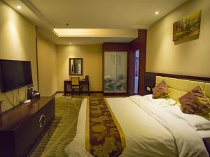 Voodi või voodid majutusasutuse GreenTree Alliance AnHui Chuzhou Laian Development District Jiyi Road Hotel toas