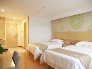 Ένα ή περισσότερα κρεβάτια σε δωμάτιο στο GreenTree Inn Xianning Tongcheng Bus Station Business Hotel +9 φωτογραφίες