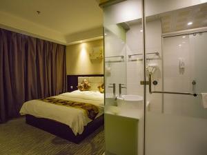 Voodi või voodid majutusasutuse GreenTree Alliance AnHui Chuzhou Laian Development District Jiyi Road Hotel toas