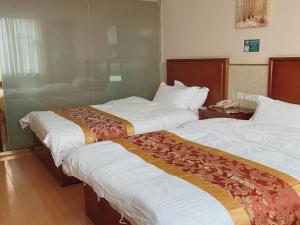 Postel nebo postele na pokoji v ubytování GreenTree Inn Beijing Shunyi Xinguozhan Express Hotel