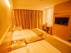 En eller flere senger på et rom på GreenTree Inn Jiangsu Nanjing Jiangning University Chenjiaoyuan Metro Station Express Hotel