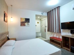 Voodi või voodid majutusasutuse Shell Yantai Youth South Road Ludong University Hotel toas