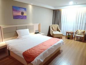 Postel nebo postele na pokoji v ubytování Shell Putian Hanjiang District Hanhua West Road Hotel + 10 fotografií