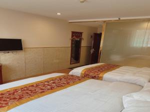 Postel nebo postele na pokoji v ubytování GreenTree Inn Beijing Shunyi Xinguozhan Express Hotel