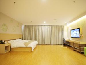 Postelja oz. postelje v sobi nastanitve GreenTree Inn Zaozhuang Xuecheng Qilianshan Road Business Hotel