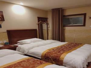 Postel nebo postele na pokoji v ubytování GreenTree Inn Beijing Shunyi Xinguozhan Express Hotel