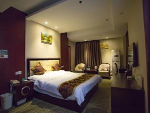 Voodi või voodid majutusasutuse GreenTree Alliance AnHui Chuzhou Laian Development District Jiyi Road Hotel toas