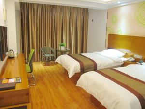 Voodi või voodid majutusasutuse GreenTree Inn Nei Monggol Autonomous Region Alxa Left banner Wealth Center Business Hotel toas
