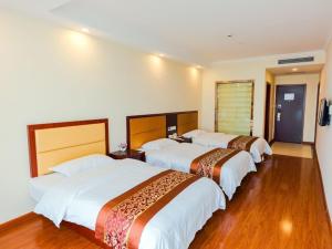 Katil atau katil-katil dalam bilik di GreenTree Inn ShangHai JiaDing the South of F1 Circuit FangTai Hardware Market Express Hotel