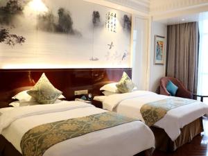 Posteľ alebo postele v izbe v ubytovaní GreenTree Eastern Yancheng Jianhu County Aobaolia Life Plaza Hotel