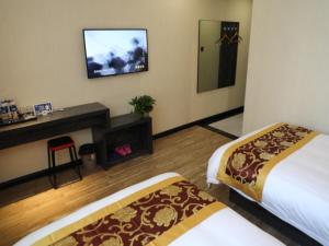 TV a/nebo společenská místnost v ubytování Shell Taiyuan City Shanxida Hospital Xiaoma Garden Hotel