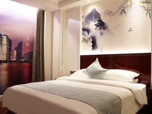 Posteľ alebo postele v izbe v ubytovaní GreenTree Eastern Yancheng Jianhu County Aobaolia Life Plaza Hotel