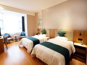 Katil atau katil-katil dalam bilik di GreenTree Inn Zhengzhou Airport