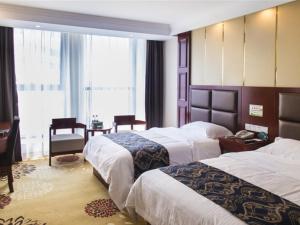 Ліжко або ліжка в номері GreenTree Inn AnHui Hefei Gaoxin District Animation Industrial Park Business Hotel