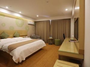 En eller flere senger på et rom på GreenTree Inn Anhui Suzhou city Si District Bianhe Avenue Business Hotel