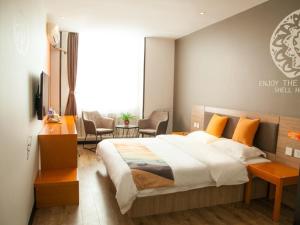 Cama o camas de una habitación en Shell Tangshan Caofeidian District Xinghai Mingdu Plaza Hotel