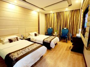 Letto o letti in una camera di GreenTree Alliance Jinhua Dongyang East Bus Station Dongyong Road Hotel