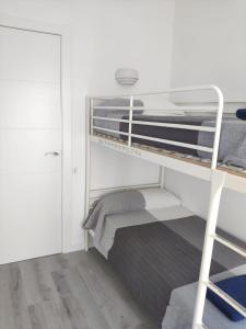 Posteľ alebo postele v izbe v ubytovaní Atico Condal