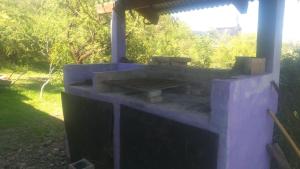 an outdoor brick oven in a yard at Cabaña de montaña in Cosquín +3 photos