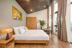 Giường trong phòng chung tại Sense Villa by Enspired Vietnam