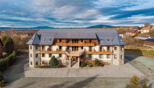 an aerial view of a large house with a roof at Orava Hotel in Vitanová