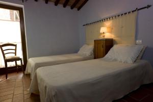 Postel nebo postele na pokoji v ubytování Agriturismo Podere Costarella