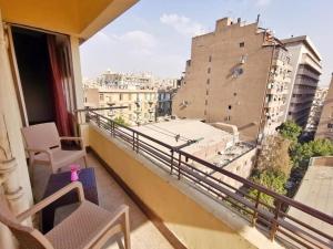 a balcony with a view of a city at Joya Apartmento in Cairo