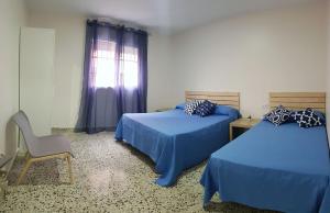 Posteľ alebo postele v izbe v ubytovaní Casa Albeniz.